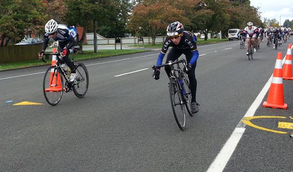 15 year old Adam Bull (Christchurch Boys High School team) crossing the line first in two hours, nine minutes and 36 seconds, winning a bunch sprint from 22 riders 